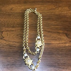 Heavy chain necklace with toggle and pearl with rhinestone accents.